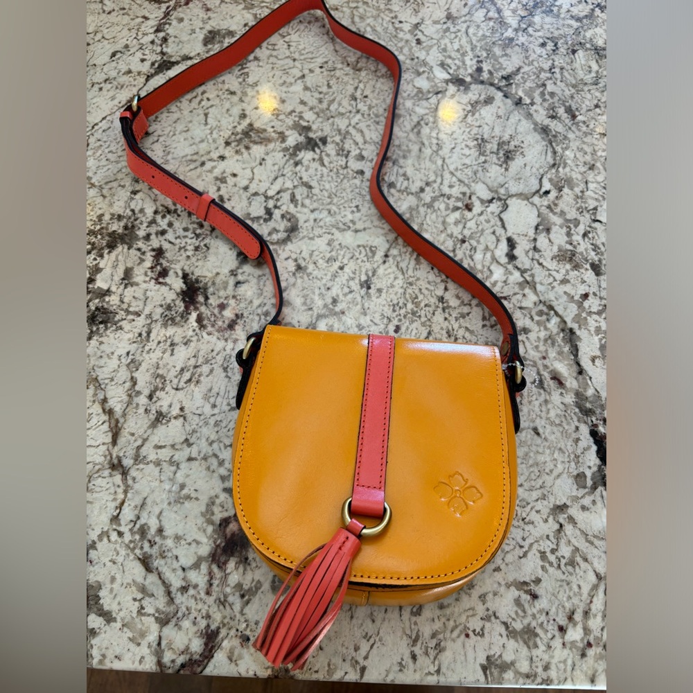 Patricia Nash 
Sunset and Coral saddle bag 
New without tags